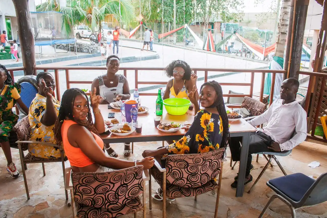 Photo of Family Seated Together at Restaurant & Pub
